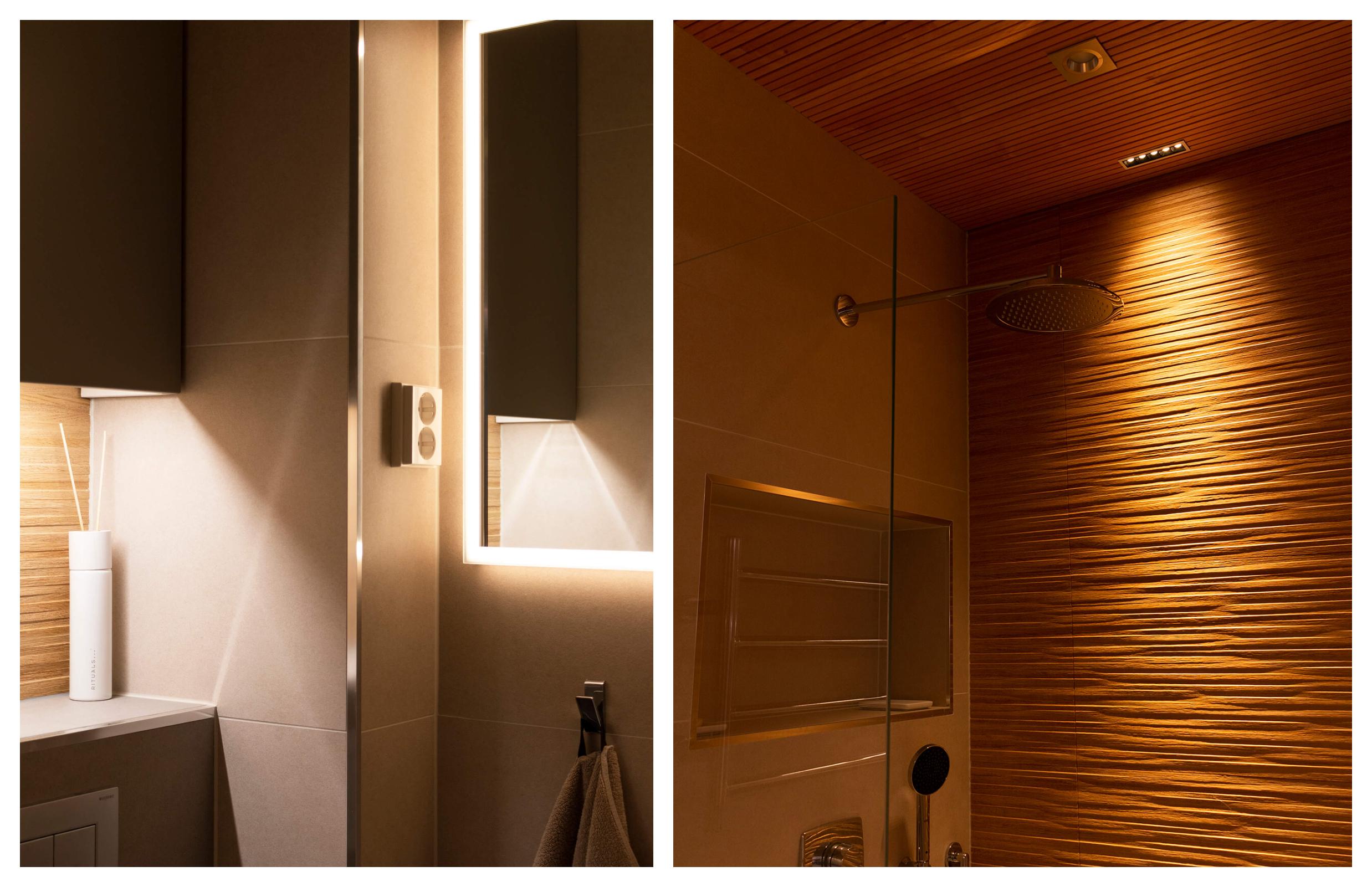 Kylpyhuoneiden valaistus on toteutettu monitasoiseksi, jotta saadaan tarvittaessa myös rauhallinen tunnelma. Suihkuseinän kaunisstruktuurinen puulaatta tulee hienosti esiin pehmeässä valossa.